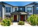 Charming townhome with a covered entry and well-maintained landscaping at 157 Ambrose St, Erie, CO 80516
