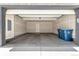 Spacious two-car garage with concrete floor and ample storage space at 157 Ambrose St, Erie, CO 80516