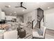 Open-concept living space with modern furniture and a view of the staircase at 157 Ambrose St, Erie, CO 80516