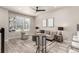 Cozy living area with neutral colors and lots of natural light from the window at 157 Ambrose St, Erie, CO 80516