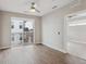 Bedroom with a sliding glass door to a balcony, hardwood floors, and plenty of natural light at 3500 S Corona St # 409, Englewood, CO 80113