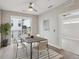 This lovely dining room features a modern light fixture, a stylish rug, and plenty of natural light at 3500 S Corona St # 409, Englewood, CO 80113