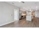 Open concept kitchen with stainless steel appliances and modern cabinets and hardwood style floors at 3500 S Corona St # 409, Englewood, CO 80113