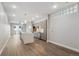 Open-concept kitchen featuring an island, stainless steel appliances, sleek cabinets, and hardwood floors at 3500 S Corona St # 409, Englewood, CO 80113