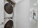 Conveniently located in-unit laundry closet with stacked washer and dryer units for space-saving efficiency at 3500 S Corona St # 409, Englewood, CO 80113