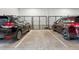 Secured parking garage with designated parking spots and enclosed storage units for tenants at 3500 S Corona St # 409, Englewood, CO 80113