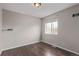 Bright bedroom with hardwood floors and a window offering natural light and views at 4152 Netherland St, Denver, CO 80249