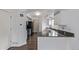 Bright kitchen featuring white cabinets and granite countertops at 4152 Netherland St, Denver, CO 80249