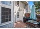 Backyard area includes a small deck with a grill, an umbrella, and patio seating at 8265 W 90Th Pl, Broomfield, CO 80021