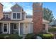 Charming townhome with a brick chimney and well-maintained landscaping at 8265 W 90Th Pl, Broomfield, CO 80021
