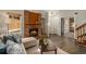 Cozy living room featuring a brick fireplace, comfortable seating, and stylish decor at 8265 W 90Th Pl, Broomfield, CO 80021