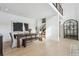 Spacious dining room with a large wooden table and bench seating at 1268 Limestone Dr, Erie, CO 80516