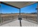 Back porch with black railing and view of the prairie at 8648 Carneros Ct, Parker, CO 80138