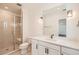 Bathroom with white vanity, undermount sink, and glass-enclosed shower at 8648 Carneros Ct, Parker, CO 80138
