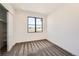 Minimalist bedroom featuring gray carpet, neutral decor, and a window with views at 8648 Carneros Ct, Parker, CO 80138