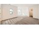 Bright bedroom featuring neutral carpet, a walk-in closet, and windows at 8648 Carneros Ct, Parker, CO 80138