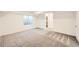 Spacious bedroom with neutral carpeting and a walk-in closet at 8648 Carneros Ct, Parker, CO 80138