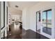 Elegant entryway with dark hardwood floors and view of the open-concept living space at 8648 Carneros Ct, Parker, CO 80138