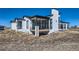 Modern two-story home with a sleek roofline and large windows at 8648 Carneros Ct, Parker, CO 80138