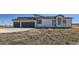 Modern home with a two-car garage and desert landscaping at 8648 Carneros Ct, Parker, CO 80138