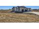 Modern home with unique architectural design, two-car garage, and drought tolerant landscaping at 8648 Carneros Ct, Parker, CO 80138