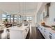 Bright, open kitchen with quartz countertop island, stainless steel appliances, and hardwood floors at 8648 Carneros Ct, Parker, CO 80138