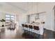 Open-concept kitchen with modern island, stainless steel appliances, and an adjacent dining area at 8648 Carneros Ct, Parker, CO 80138