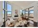 Bright living room featuring floor to ceiling windows, modern fireplace, and contemporary decor at 8648 Carneros Ct, Parker, CO 80138