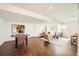 Cozy living room featuring modern decor and wood laminate flooring at 8648 Carneros Ct, Parker, CO 80138