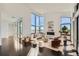 Spacious living room featuring floor-to-ceiling windows, modern fireplace, and stylish furnishings at 8648 Carneros Ct, Parker, CO 80138