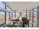 Bright home office featuring large windows offering views of the surrounding landscape, a modern desk, and comfortable seating at 8648 Carneros Ct, Parker, CO 80138
