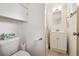 Clean and functional bathroom with white fixtures, including a vanity with storage and shower at 2251 Braun Dr, Golden, CO 80401