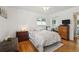 Cozy bedroom featuring hardwood floors, closet with mirrored doors, and a comfortable bed at 2251 Braun Dr, Golden, CO 80401