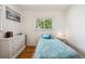 Comfortable bedroom features natural light, hardwood floors, and soothing decor, perfect for relaxation at 2251 Braun Dr, Golden, CO 80401
