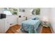 Inviting bedroom with bright windows, hardwood flooring, and fresh, light blue accents at 2251 Braun Dr, Golden, CO 80401