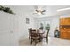 Cozy dining area featuring tile floor, white walls, ceiling fan and an exit to the outdoor area at 2251 Braun Dr, Golden, CO 80401