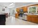 Bright eat-in kitchen features tile floors, stainless appliances and wood cabinets at 2251 Braun Dr, Golden, CO 80401
