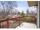 Balcony with wood railing overlooking a quiet neighborhood at 841 Niagara St, Denver, CO 80220