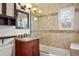 Well-lit bathroom featuring a glass-enclosed shower, granite countertops, and a custom vanity at 841 Niagara St, Denver, CO 80220