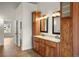 Elegant bathroom featuring a double sink vanity, granite countertops, and custom wood cabinets at 841 Niagara St, Denver, CO 80220