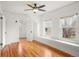 Bright bedroom featuring hardwood floors, built-in window seats, and ample natural light at 841 Niagara St, Denver, CO 80220
