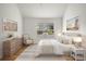 Comfortable primary bedroom featuring neutral tones, natural light, and a peaceful aesthetic at 841 Niagara St, Denver, CO 80220