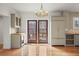 Open dining area with wood floors, modern light fixture, and views of the outdoor deck at 841 Niagara St, Denver, CO 80220