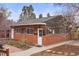 View of the guest house showing brick and wood exterior at 841 Niagara St, Denver, CO 80220
