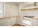 Kitchen with wood countertops, stylish cabinets, and a vintage-style oven at 841 Niagara St, Denver, CO 80220