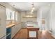 Bright kitchen with butcher block countertops, a farmhouse sink, and stainless steel appliances at 841 Niagara St, Denver, CO 80220