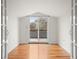 Living room with hardwood floors and access to the outside balcony at 841 Niagara St, Denver, CO 80220