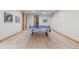 Finished basement featuring laminate flooring and a Kettler ping pong table at 25350 Ridge Way, Golden, CO 80401