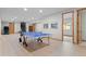Spacious basement with laminate flooring, access to stairs, and room for recreation at 25350 Ridge Way, Golden, CO 80401