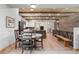 Open dining room and kitchen area features beam ceiling and hardwood floors at 25350 Ridge Way, Golden, CO 80401